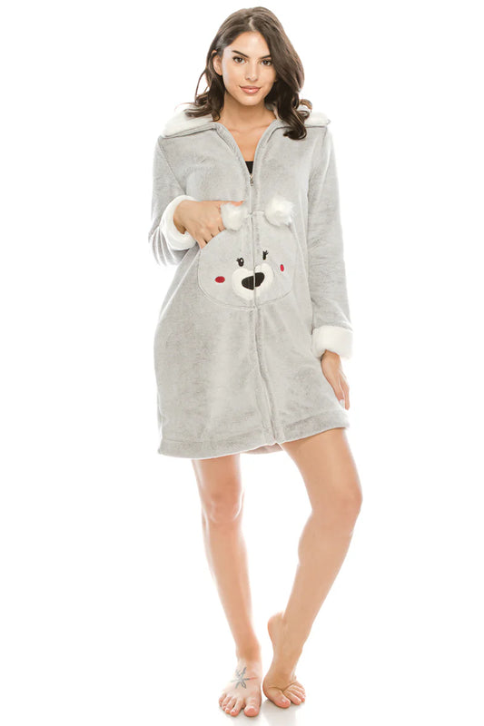Woman wearing a gray robe with a teddy bear hood on a white background