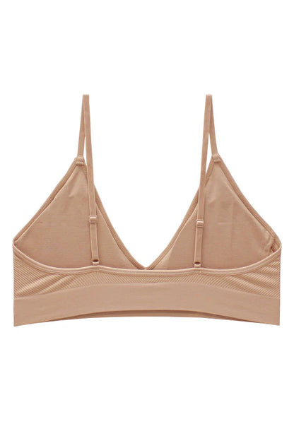Beige bralette on a white background
