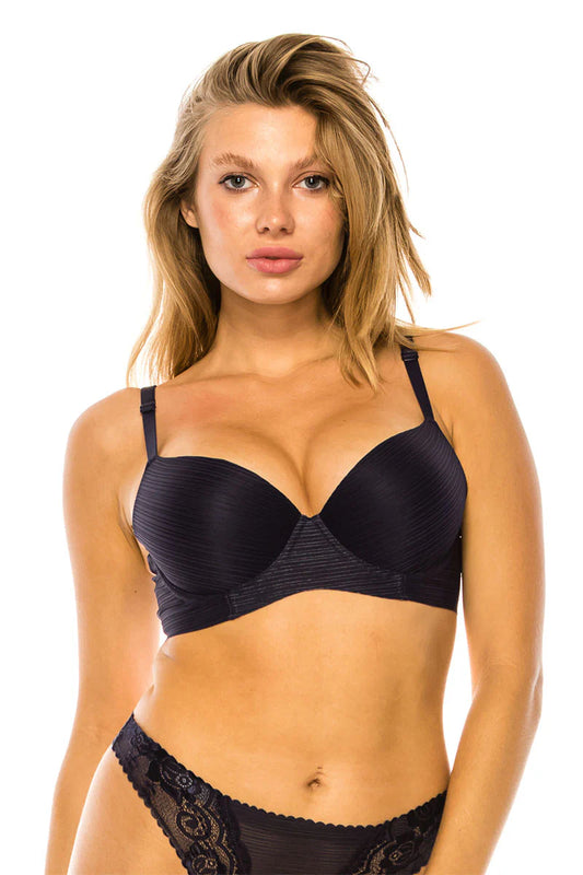 Woman wearing a black bra and panties set on a white background