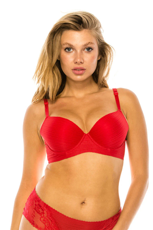 Woman wearing a red bra and underwear set on a white background