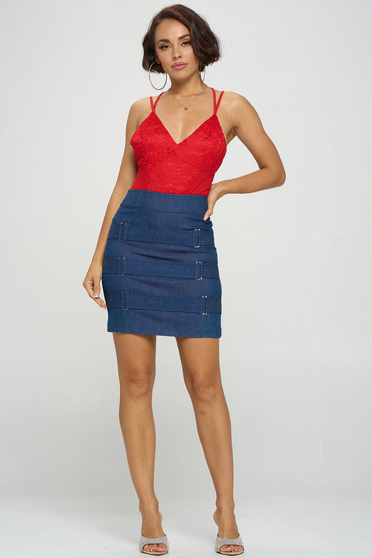 Woman wearing a red top and blue denim skirt on a white background