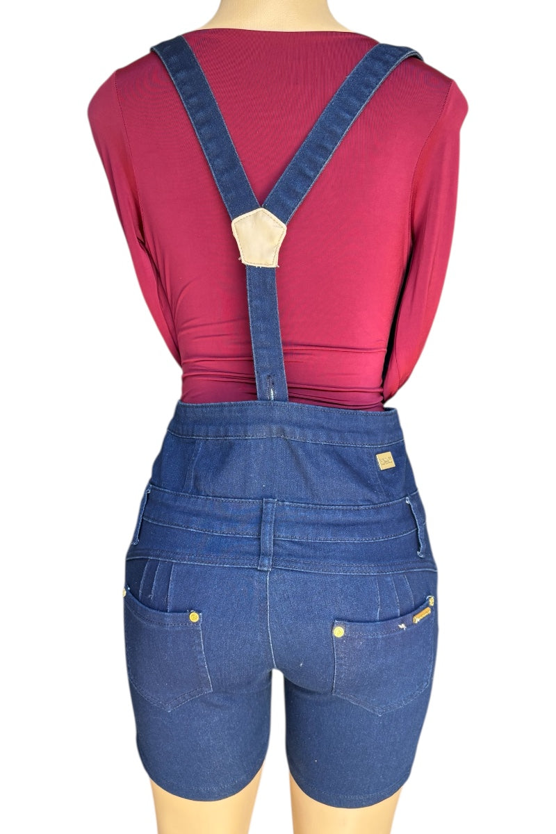 Blue denim overalls worn by a mannequin on a white background