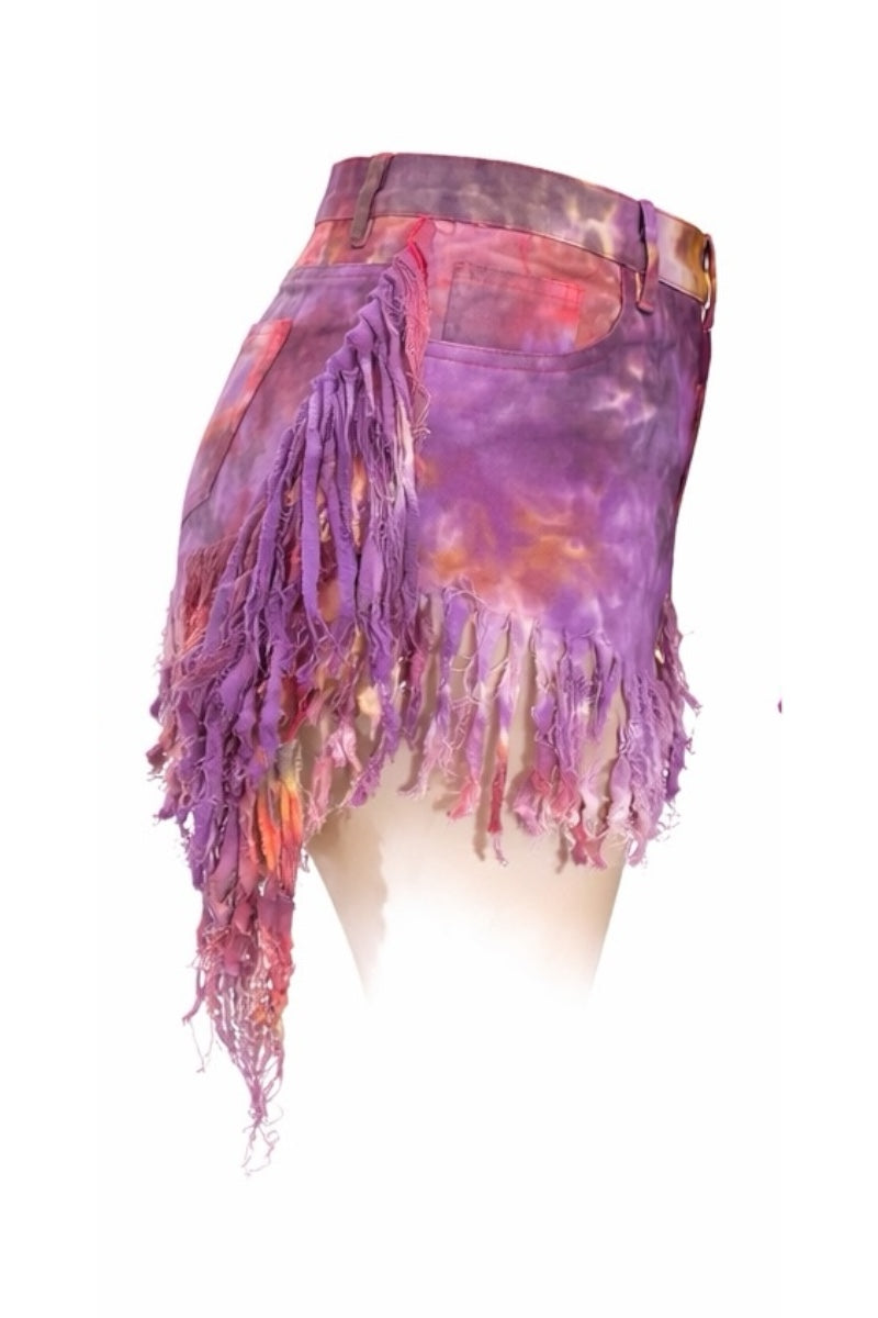Tie-dye shorts with fringe on a white background