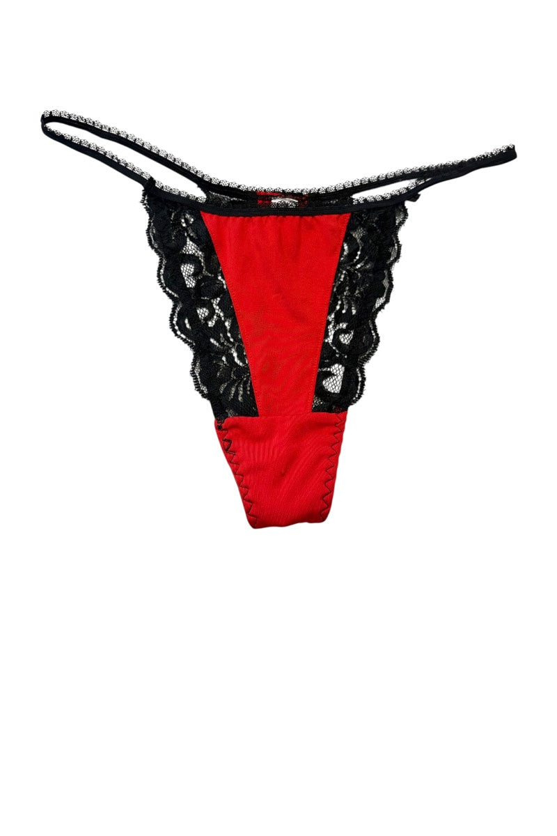 Red and black lace thong underwear on a plain white background.