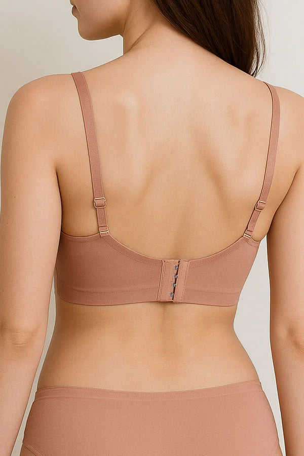 beige bra and panties set on a neutral background