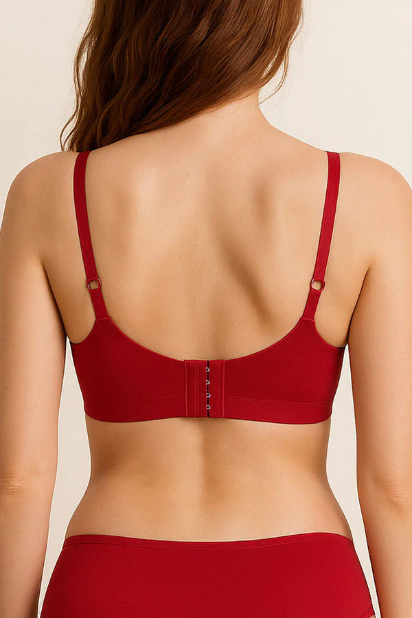 Red bra and panties set on a beige background