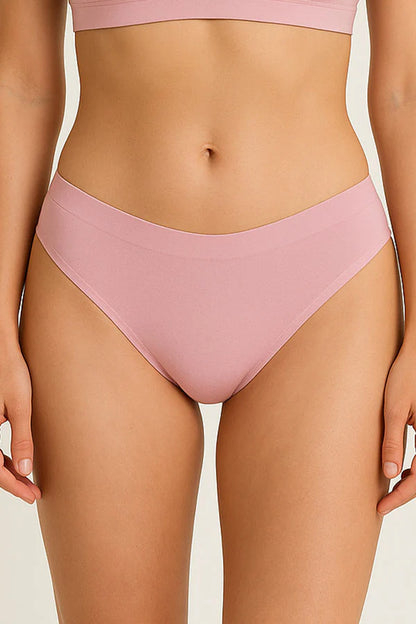 Pink bikini bottom worn by a person on a plain background