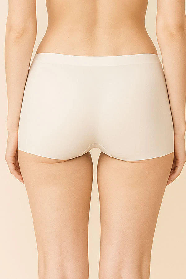 white underwear worn by a person on a beige background