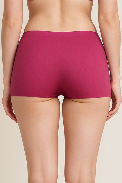 Person wearing a pair of Dark Fuchsia underwear on a beige background