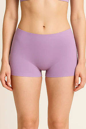 Person wearing light purple shorts on a beige background