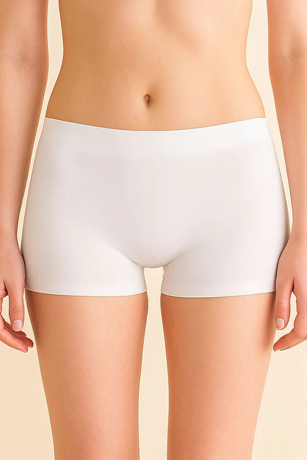 White underwear worn by a person on a beige background
