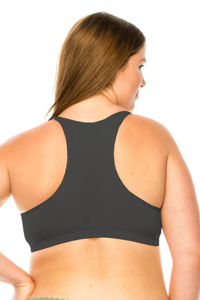 Woman wearing a black bra on a white background