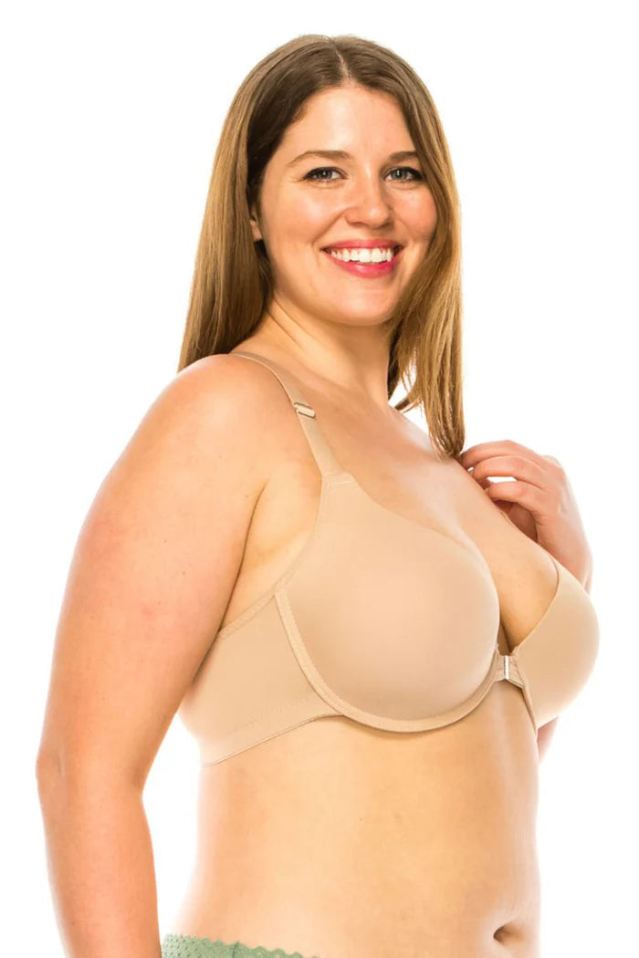 Woman wearing a beige bra on a white background