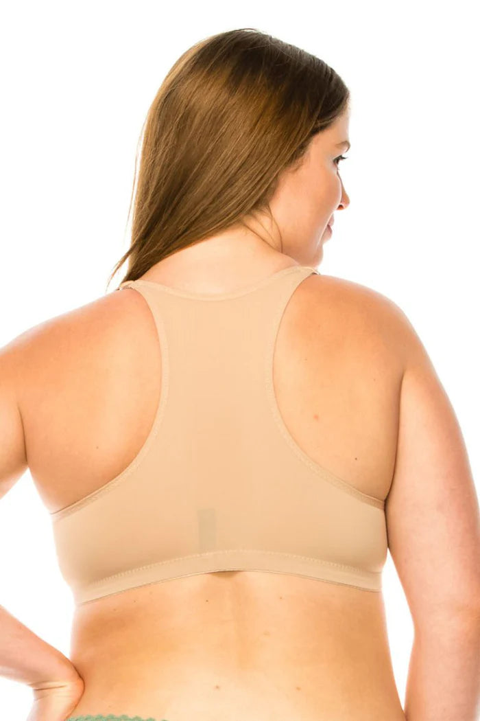 Woman wearing a beige bra on a white background