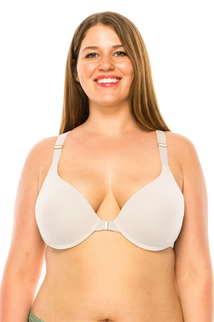 Woman wearing a white bra on a white background