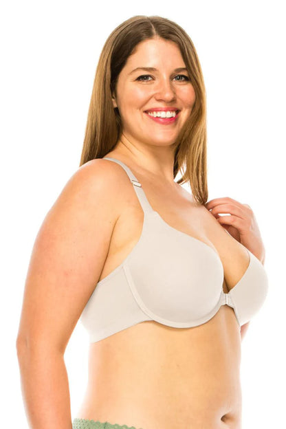Woman wearing a white bra on a white background