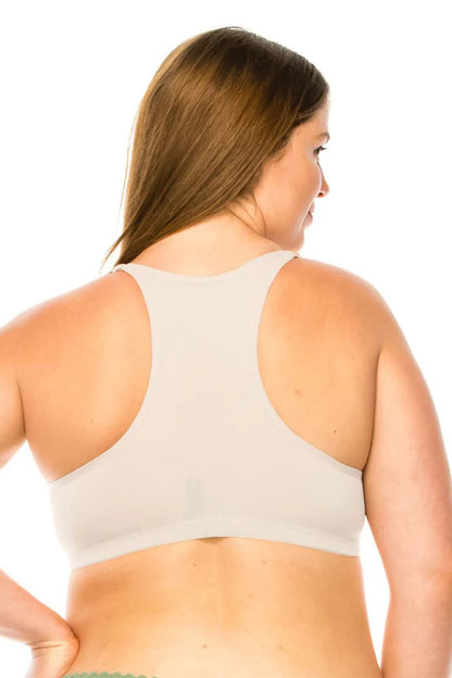 Woman wearing a white bra on a white background