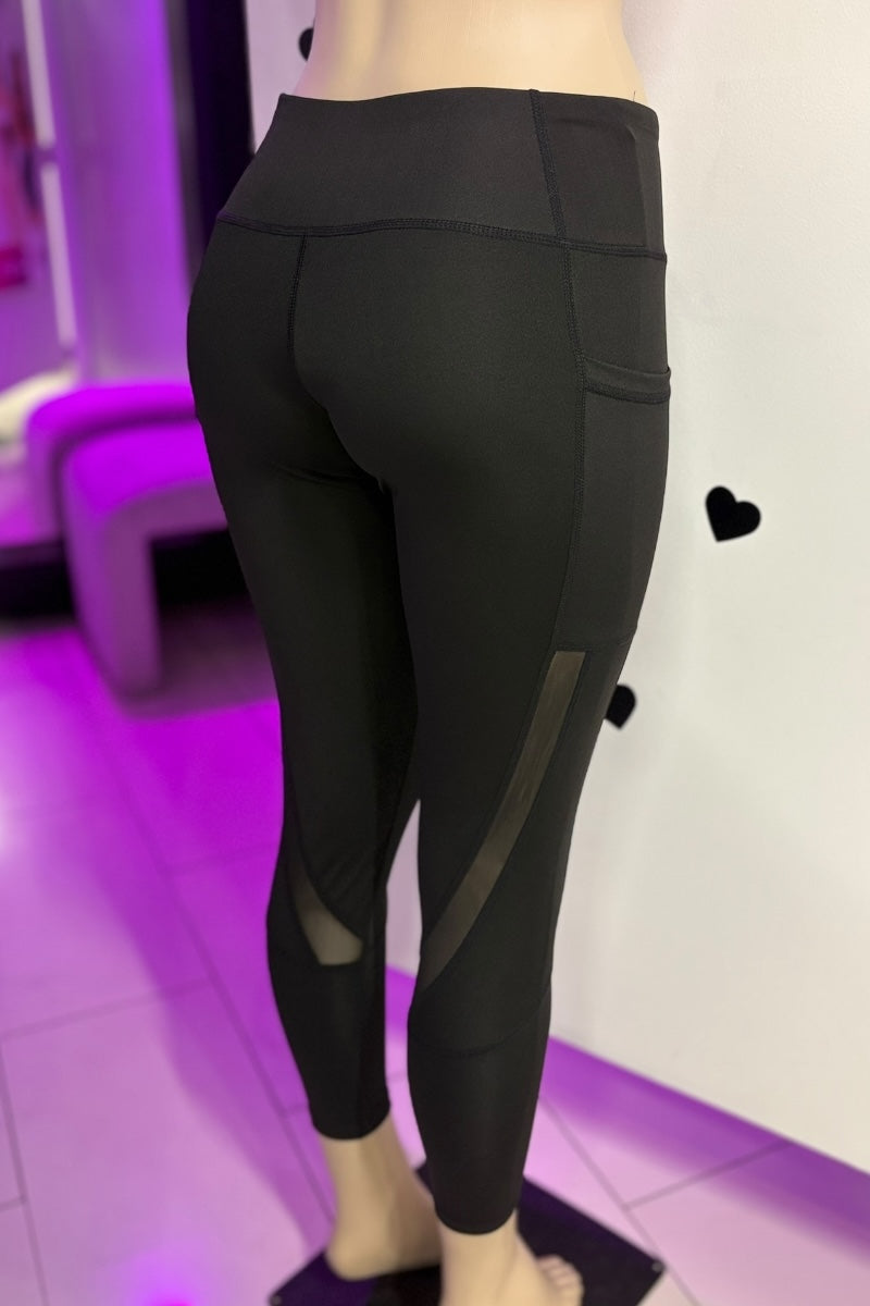 Black leggings worn by a mannequin on a white background