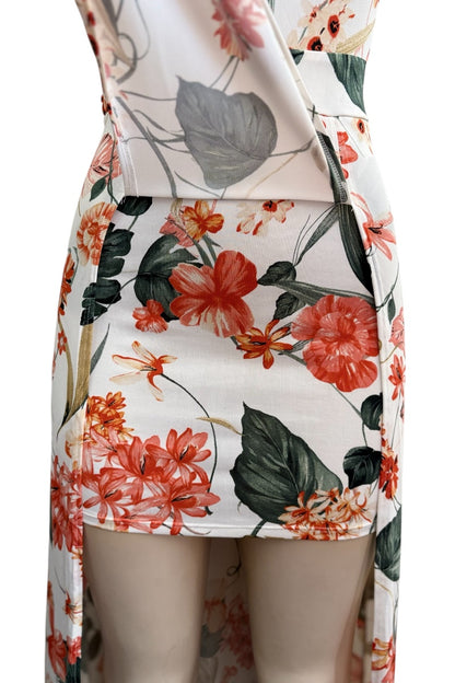 Floral dress with orange flowers and green leaves on a white background