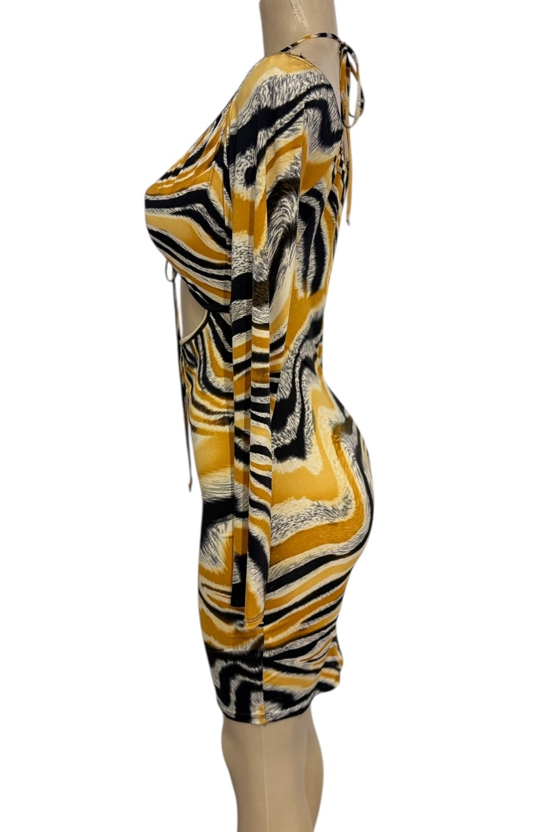 Mannequin wearing a patterned dress with yellow, black, and white design on a white background