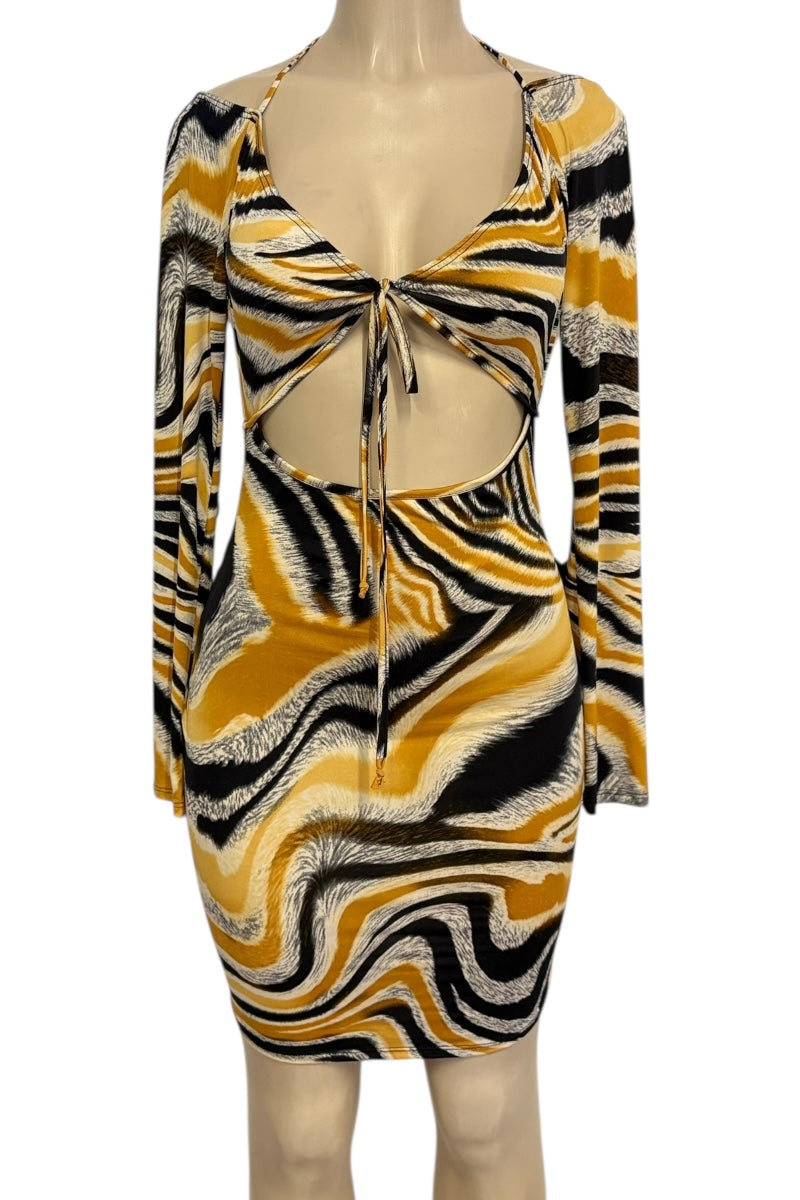 Mannequin wearing a patterned dress with long sleeves on a white background