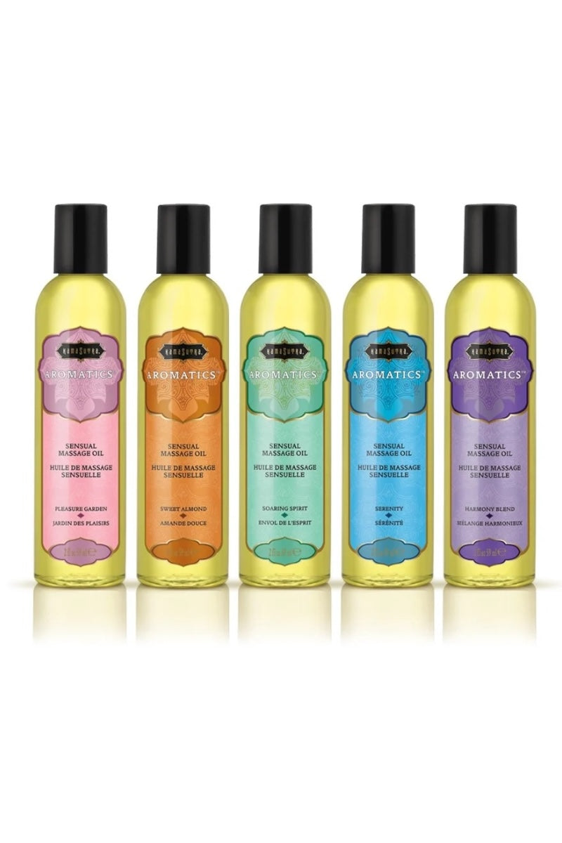 Five bottles of Aromatics massage oils with colorful labels on a white background