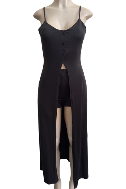 Black dress set with a slit on a mannequin against a white background