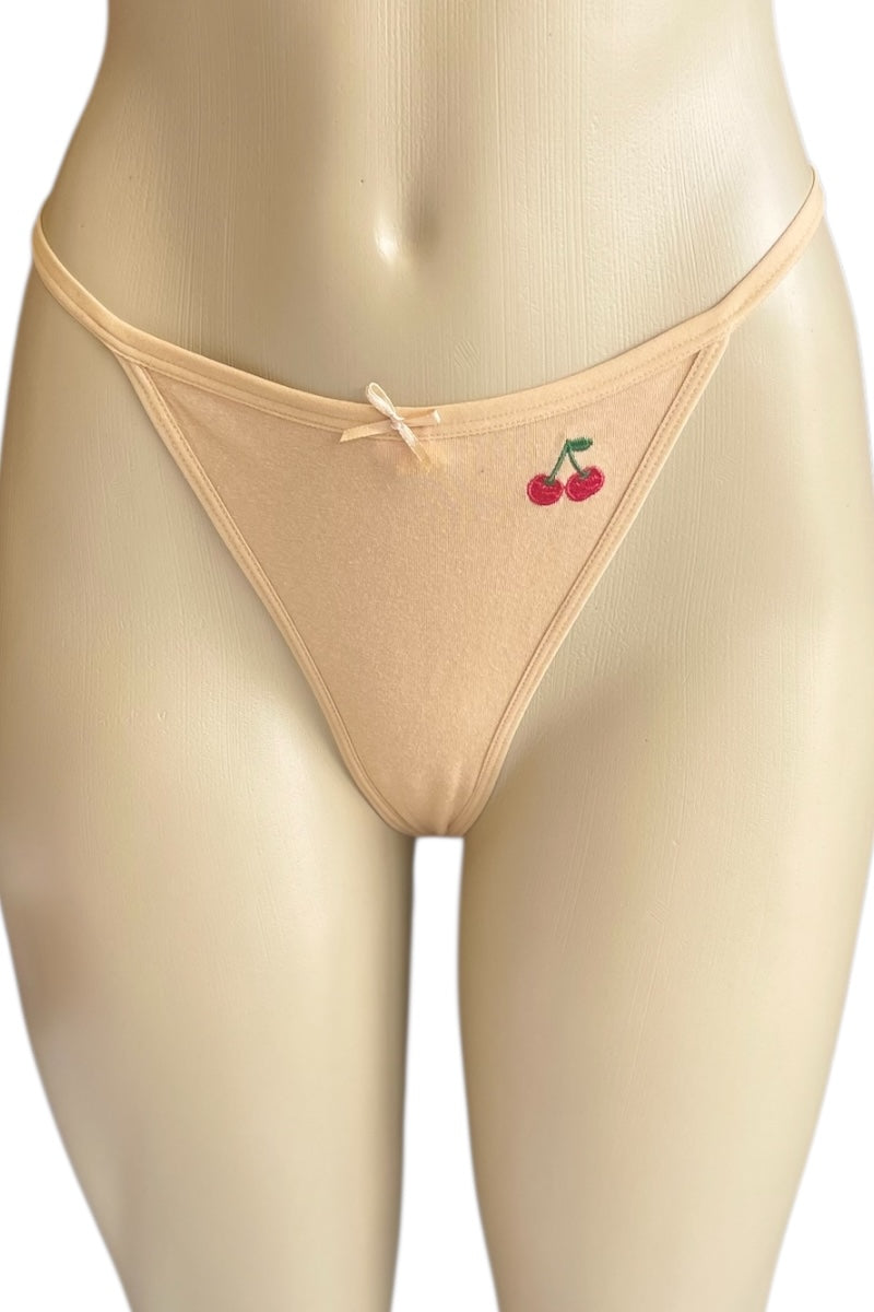 Beige thong with cherry design on a white background