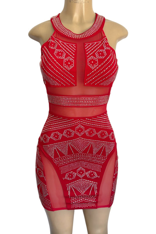 Red dress with studded patterns on a mannequin against a white background