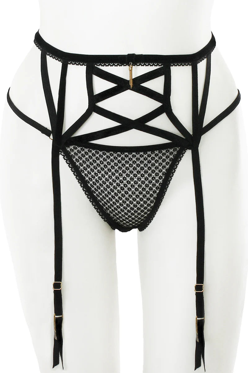 Black strappy lingerie set on a white background
