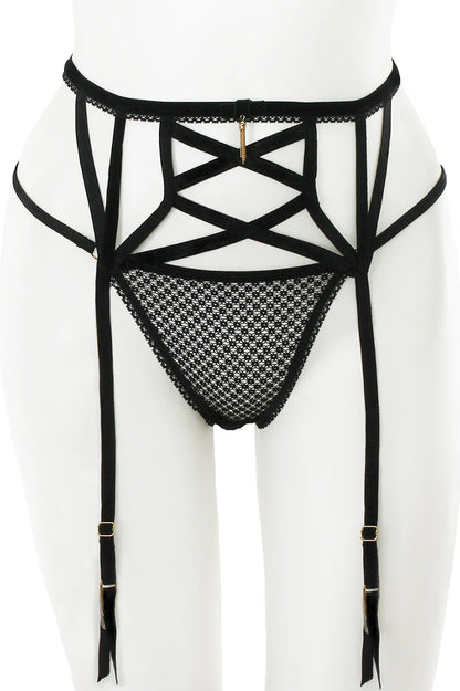 Black strappy lingerie set on a white background