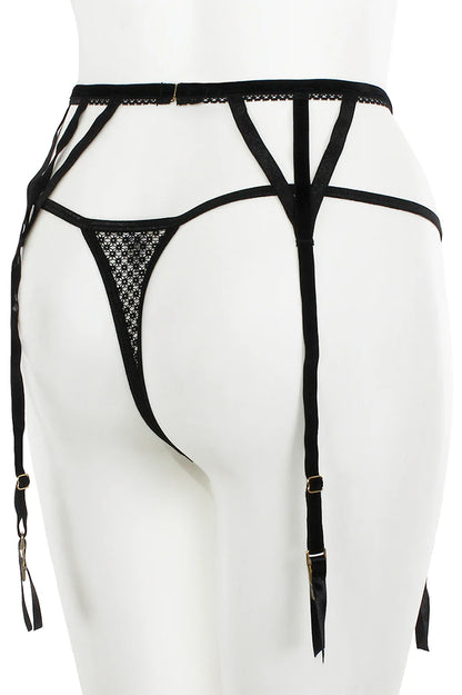 Black strappy lingerie on a mannequin against a white background