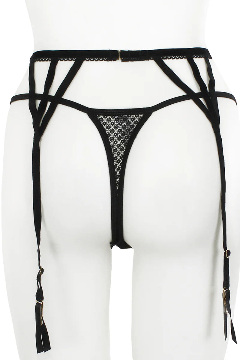 Black strappy lingerie set on a white mannequin