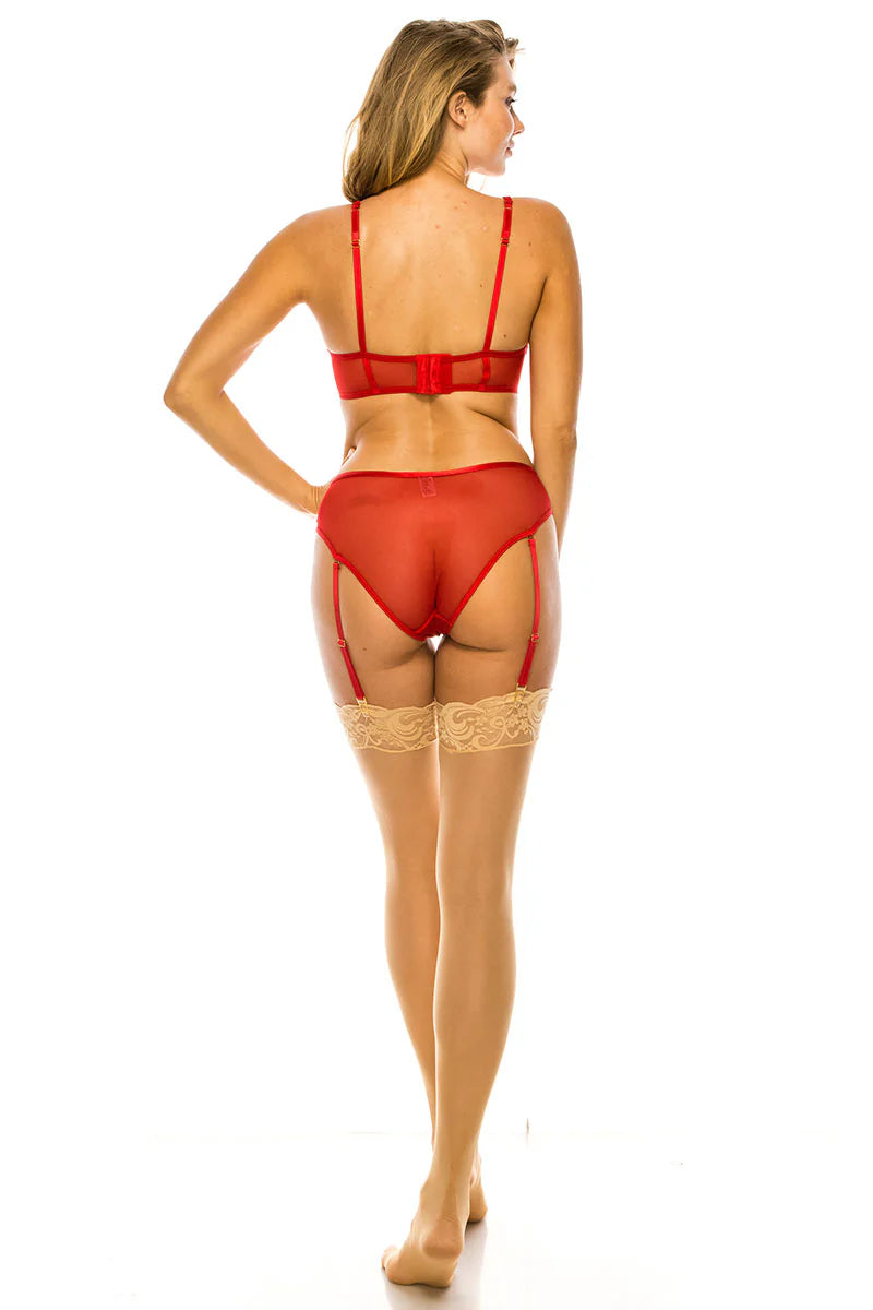 Woman wearing a red lingerie set on a white background