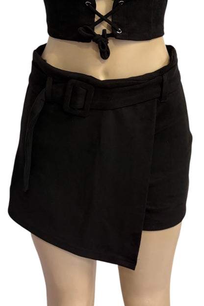 Black wrap-style mini skirt with a wide waist belt and large square buckle, shown on a mannequin torso against a white background.