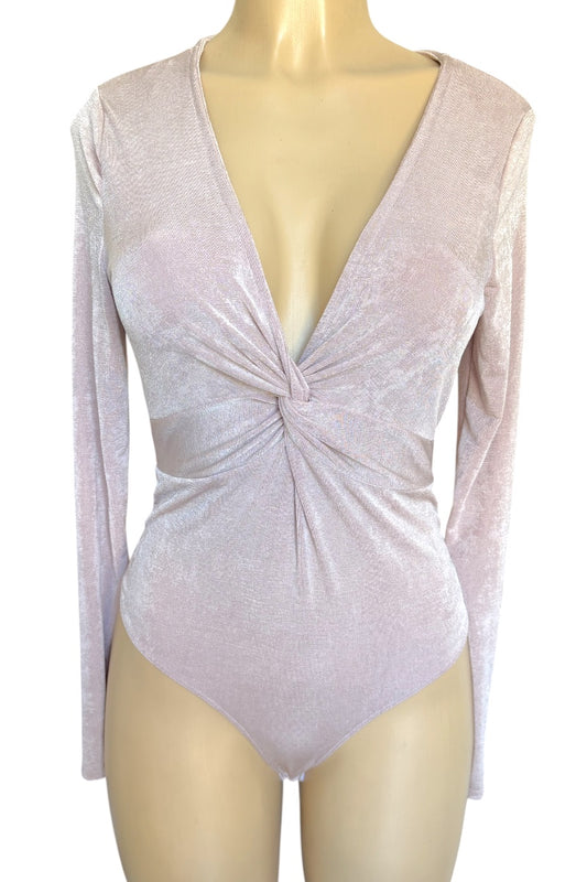 Light pink long-sleeve bodysuit with a front twist on a mannequin against a white background