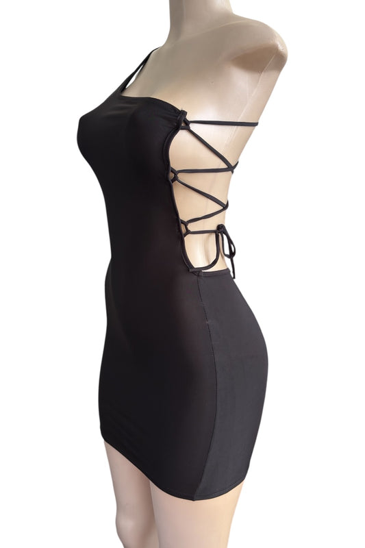 Black strappy dress on a mannequin against a white background