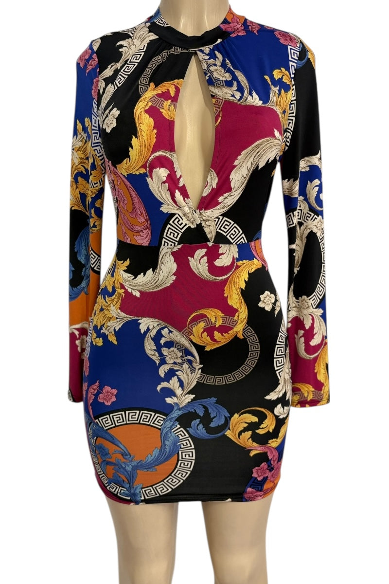 Colorful patterned dress on a mannequin against a white background