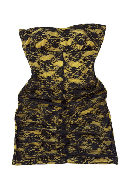 Black and yellow patterned dress on a white background