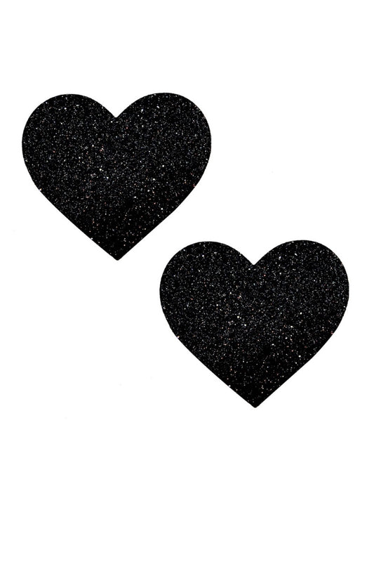 Two black heart-shaped pasties on a white background