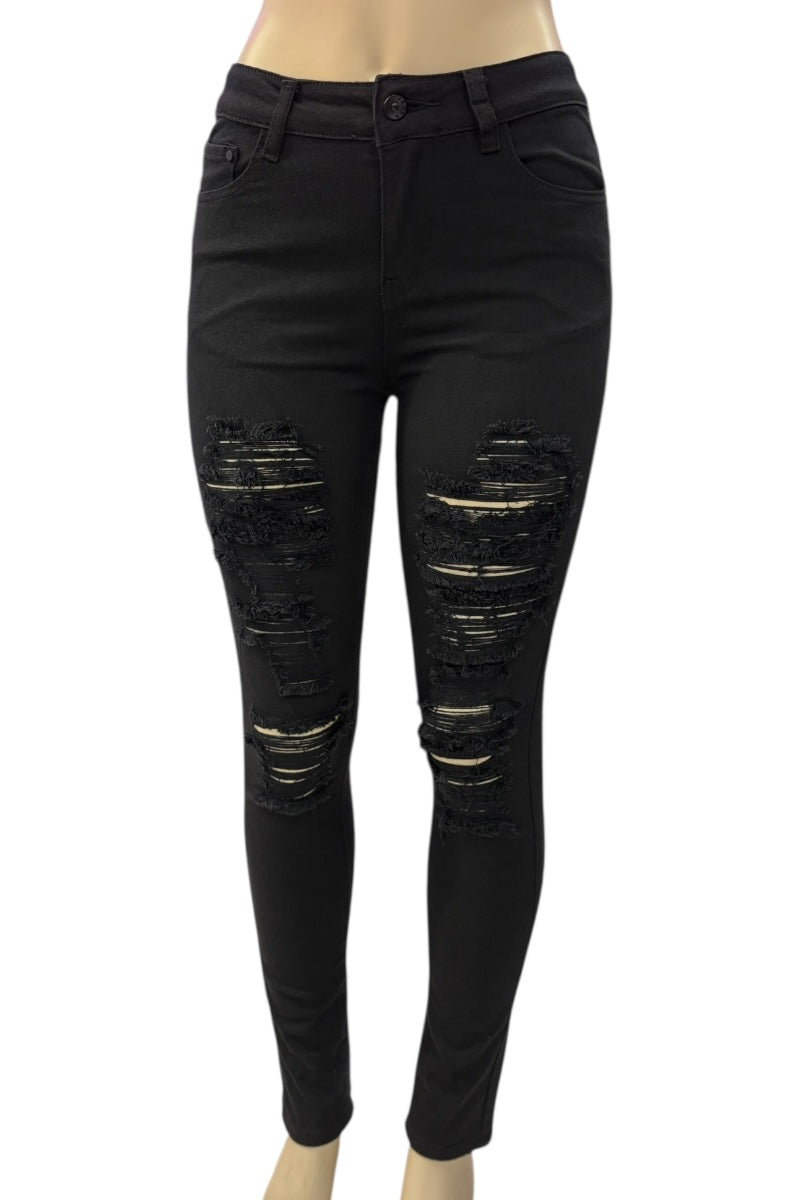 Black distressed jeans on a white background