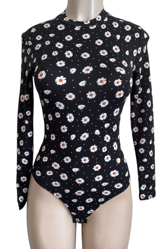 Black bodysuit with floral pattern on a mannequin against a white background