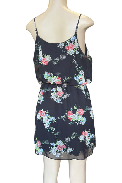 Floral dress on a mannequin against a white background