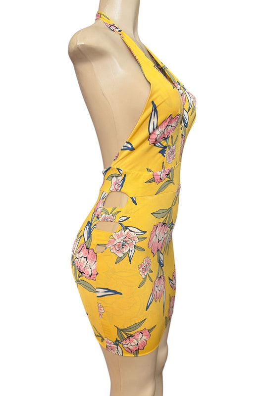 Yellow floral dress on a mannequin against a white background