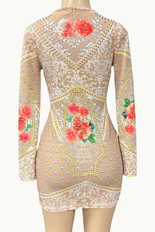 Beige dress with floral embroidery on a mannequin against a white background