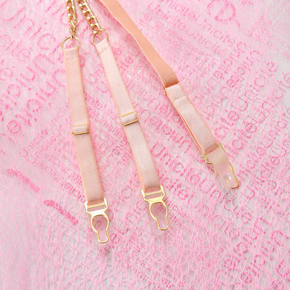 Three pink garters with gold hardware on a pink textured background