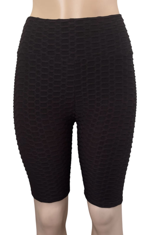 Black textured shorts on a white background