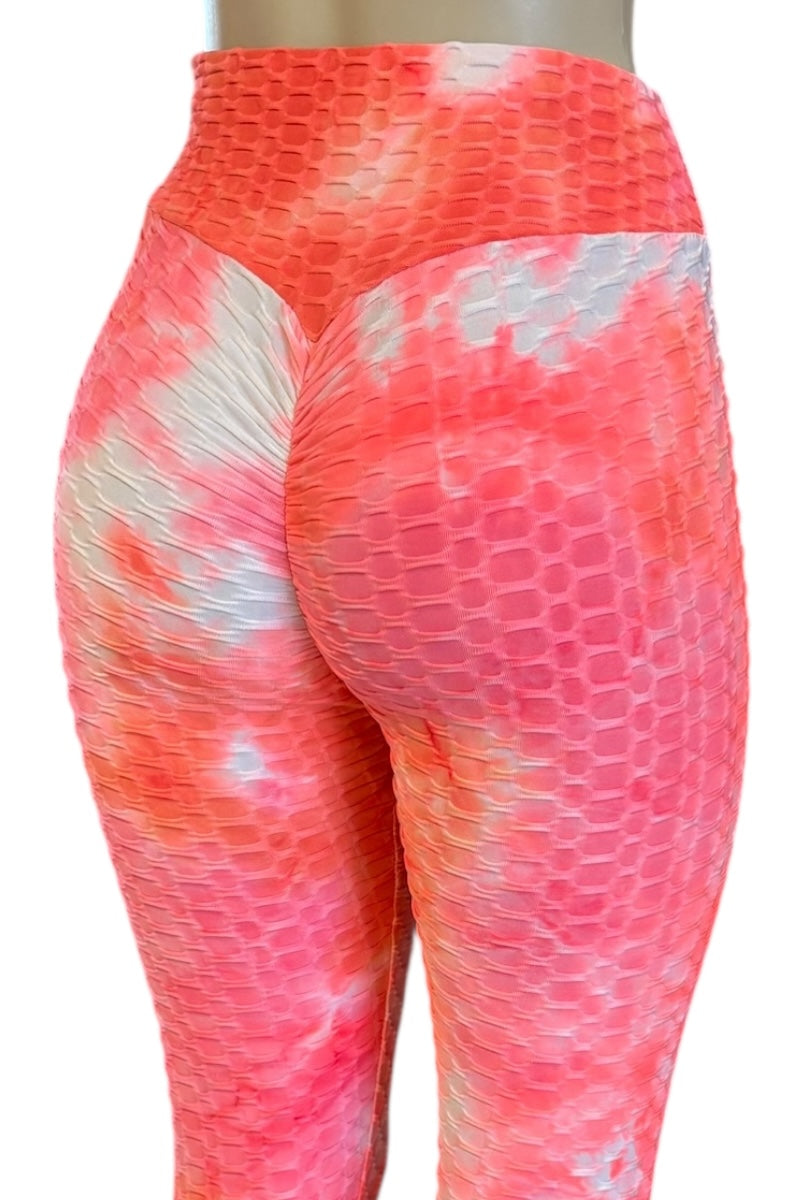 Tie-dye leggings with pink and white pattern on a white background