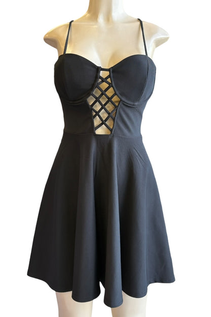 Black dress on a mannequin against a white background