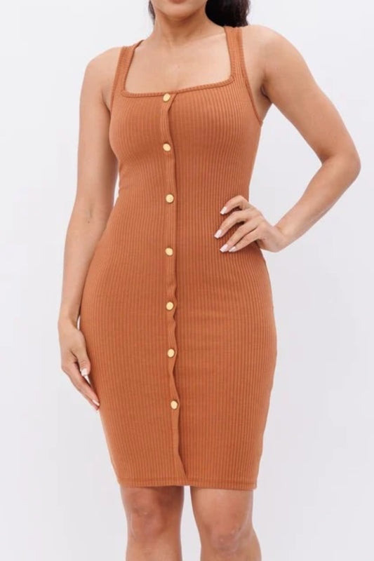 Woman wearing a rust ribbed dress with buttons on a white background